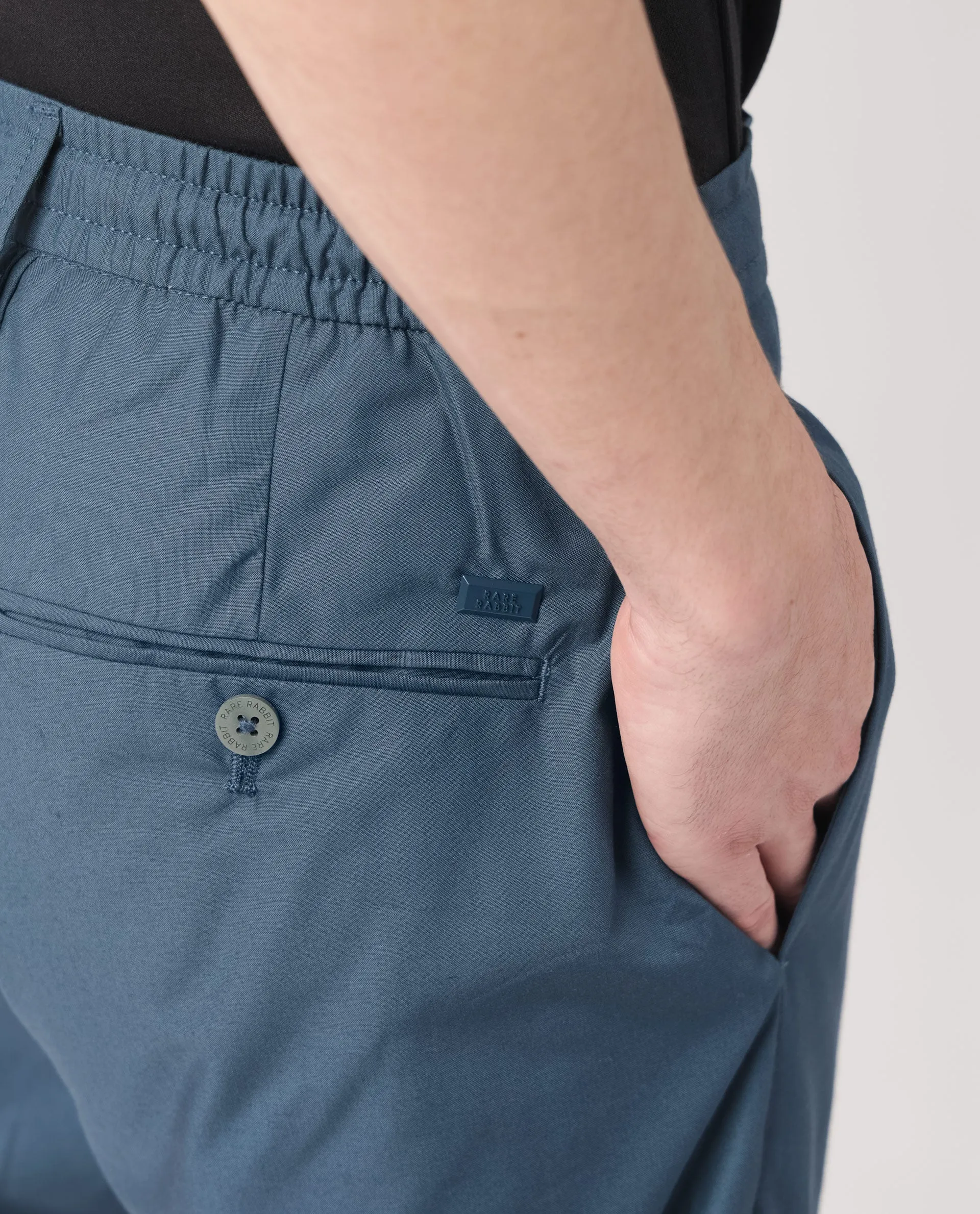 Rare Rabbit Men's Aux Petrol Solid Mid-Rise With Drawstring And Elastic Waistband Regular Fit Trouser